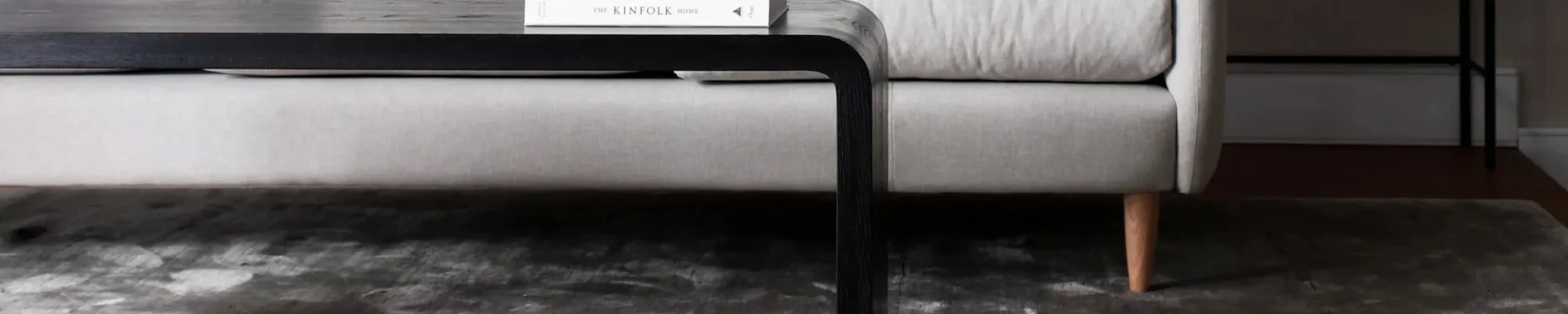 black coffee table and gray sofa
